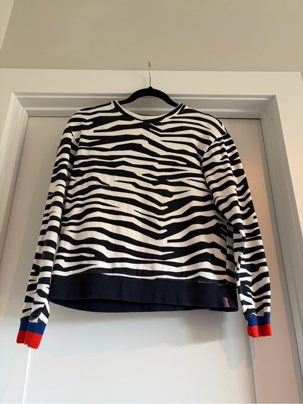 KULE Black & White Zebra Stripe Crew Sweater with Red & Blue Cuff Accents